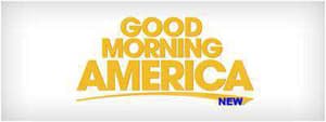 The image features a graphic with text that reads 'GOOD MORNING AMERICA' in bold yellow letters, set against a white background with a slight shadow effect, suggesting a promotional banner for a television show or network.